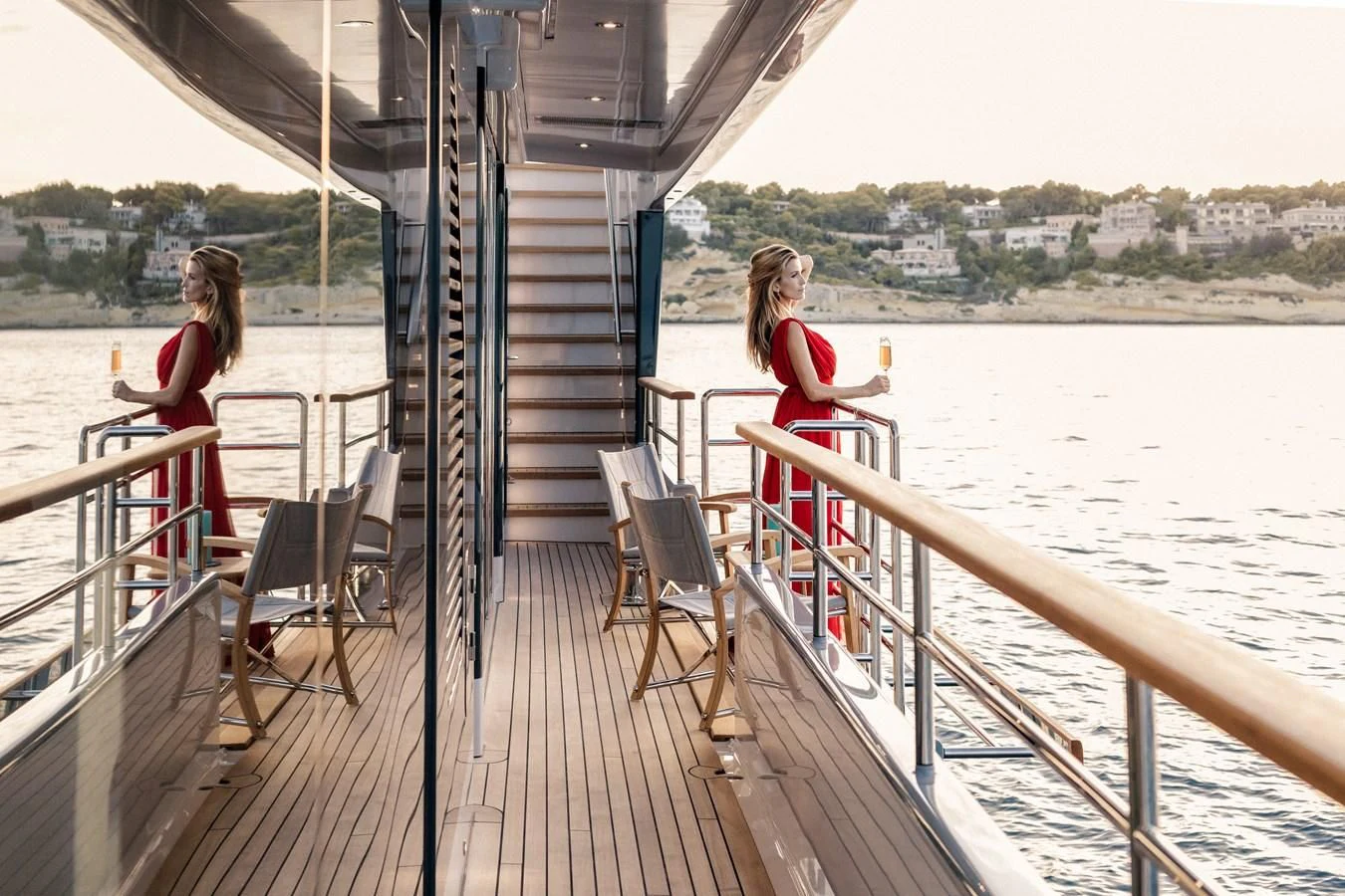 a couple of women sitting on a deck on a boat aboard DELTA ONE Yacht for Charter
