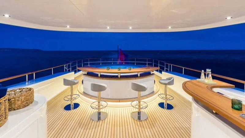 a room with a table and chairs aboard DELTA ONE Yacht for Charter