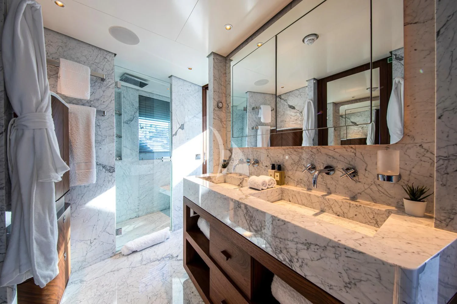 a bathroom with a large mirror aboard DELTA ONE Yacht for Charter