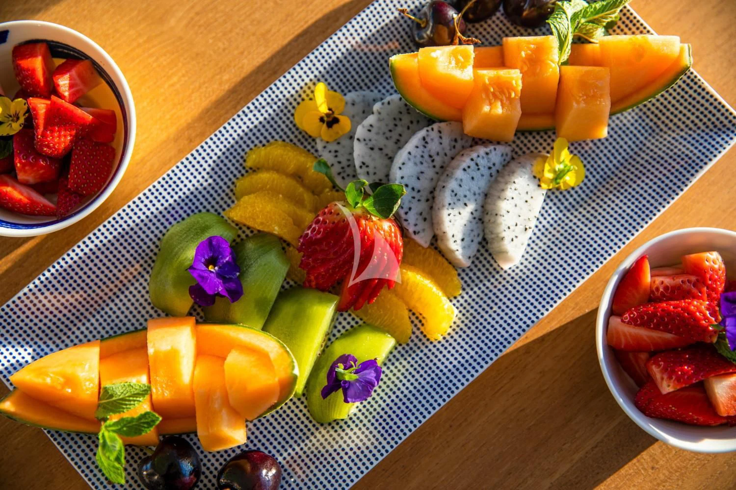 a tray of food aboard DELTA ONE Yacht for Charter