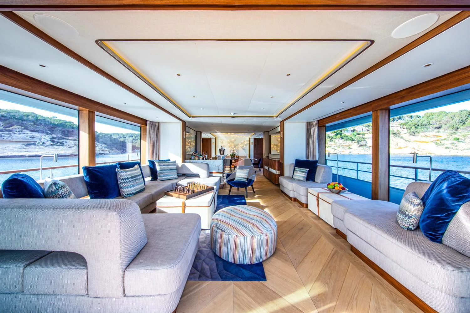 a living room with a large window aboard DELTA ONE Yacht for Charter