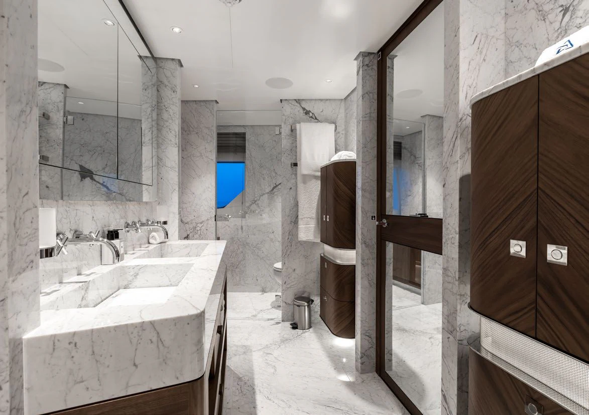 a bathroom with a sink and a mirror aboard DELTA ONE Yacht for Charter