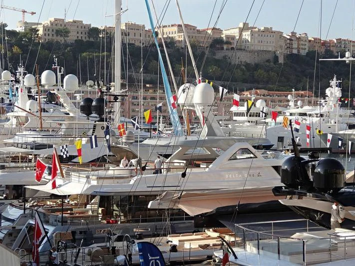 a large airplane is parked in a large room aboard DELTA ONE Yacht for Charter