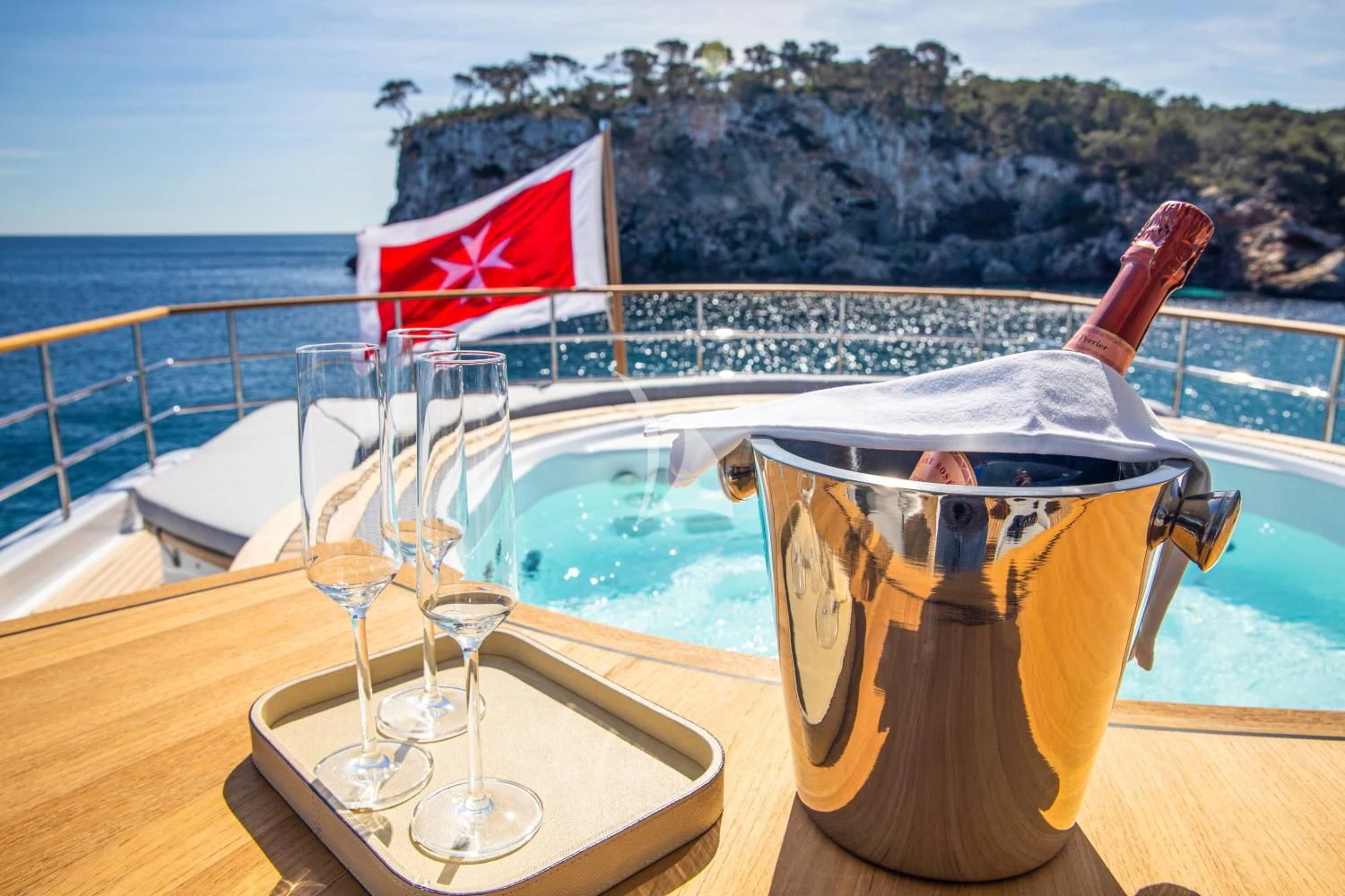 a glass of champagne on a boat aboard DELTA ONE Yacht for Charter