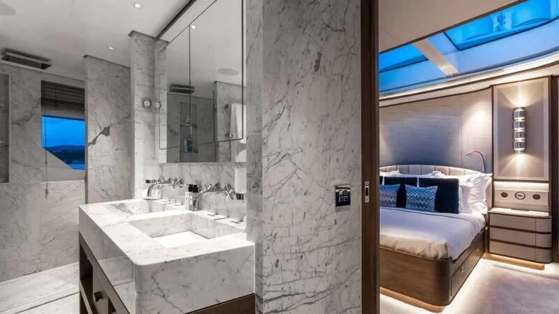 a bathroom with a bed and sink aboard DELTA ONE Yacht for Charter
