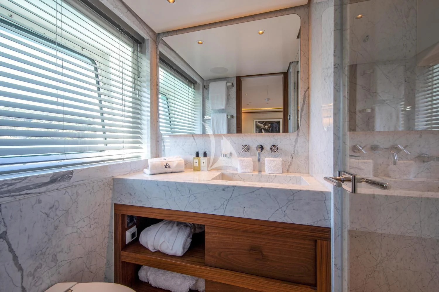 a bathroom with a sink and a mirror aboard DELTA ONE Yacht for Charter