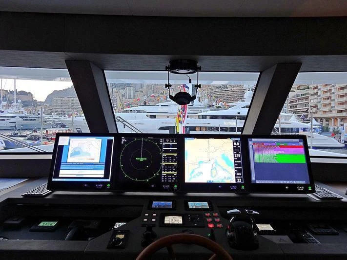a group of monitors in a control room aboard DELTA ONE Yacht for Charter