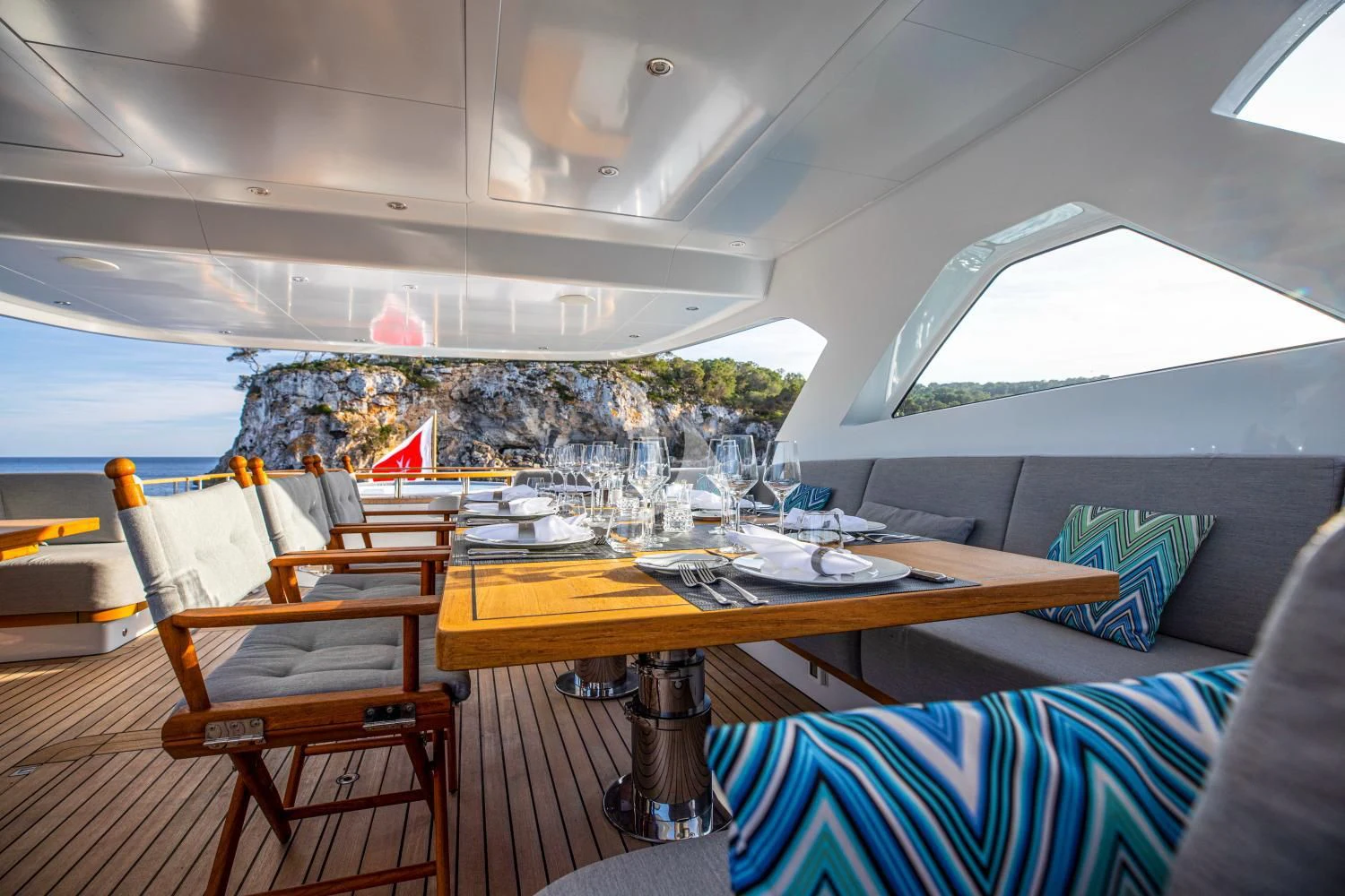 a room with a table and chairs aboard DELTA ONE Yacht for Charter