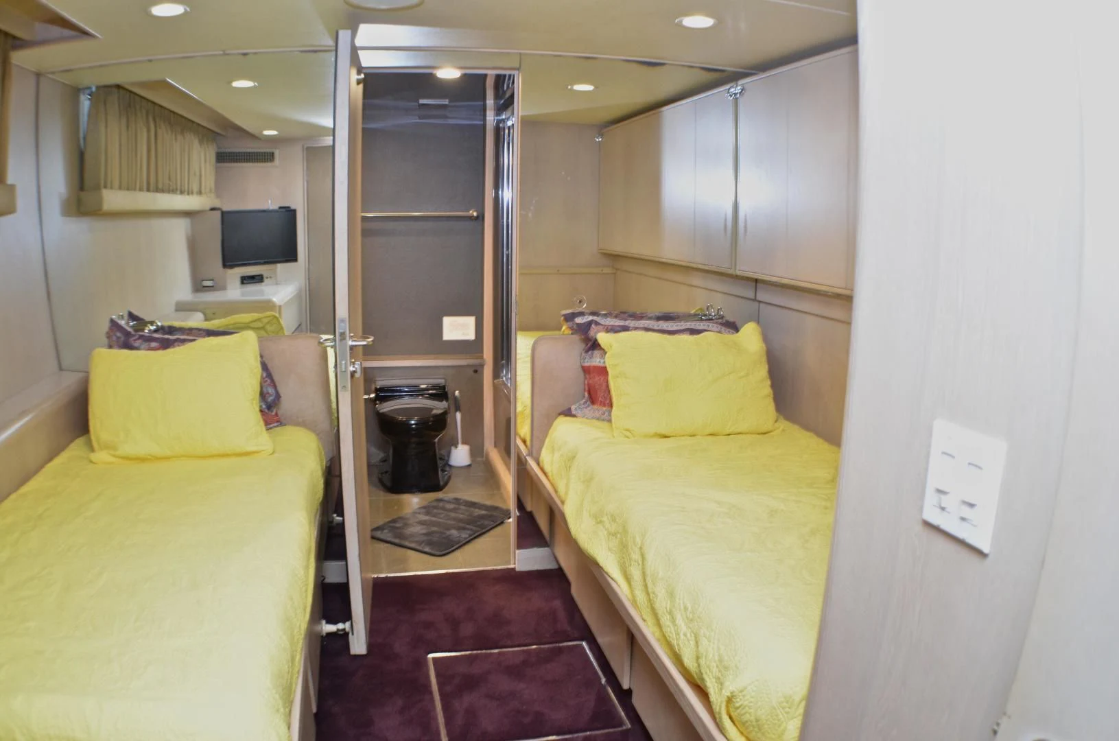 a room with a bed and a tv aboard AUDACITY Yacht for Sale