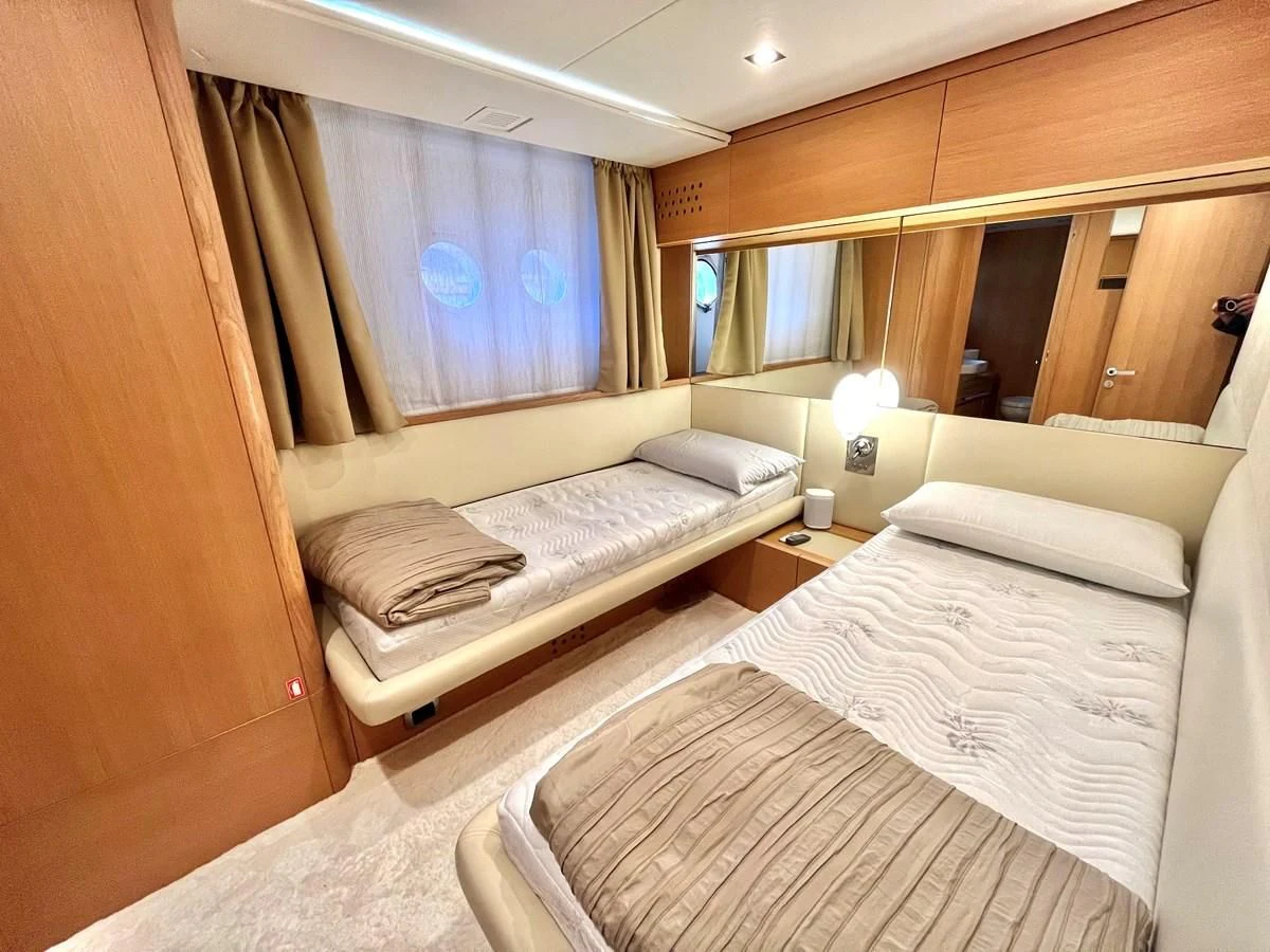 a room with beds and a window aboard AICON 85 Yacht for Sale