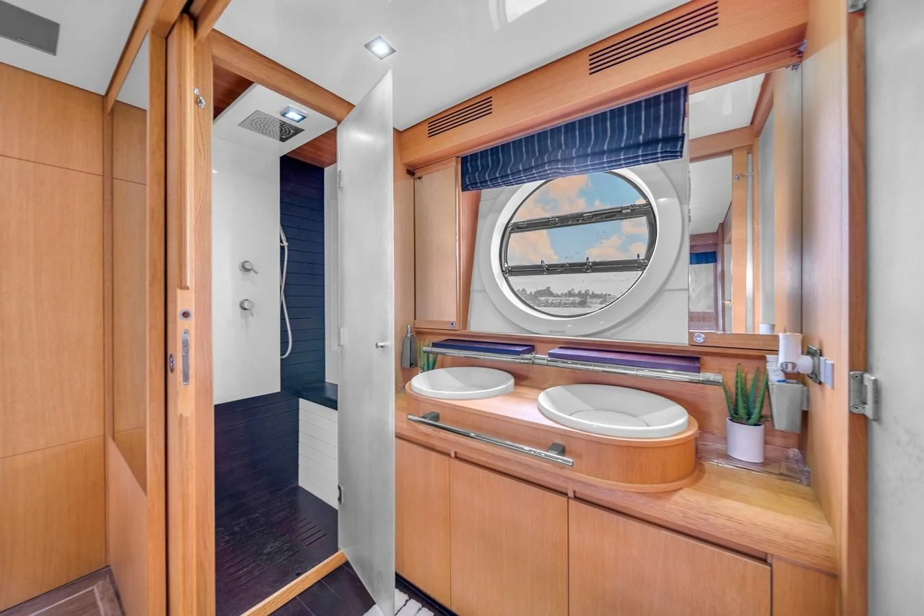 a bathroom with a large mirror aboard AICON 85 Yacht for Sale