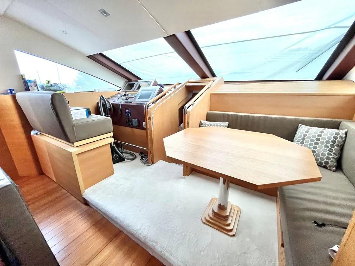a room with a couch and a table aboard AICON 85 Yacht for Sale