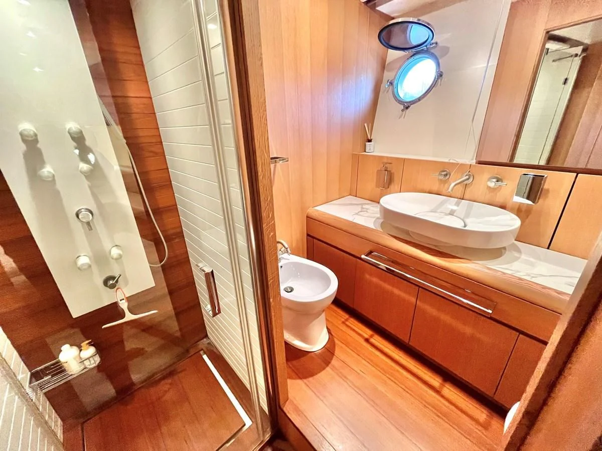 a bathroom with a sink toilet and a bathtub aboard AICON 85 Yacht for Sale
