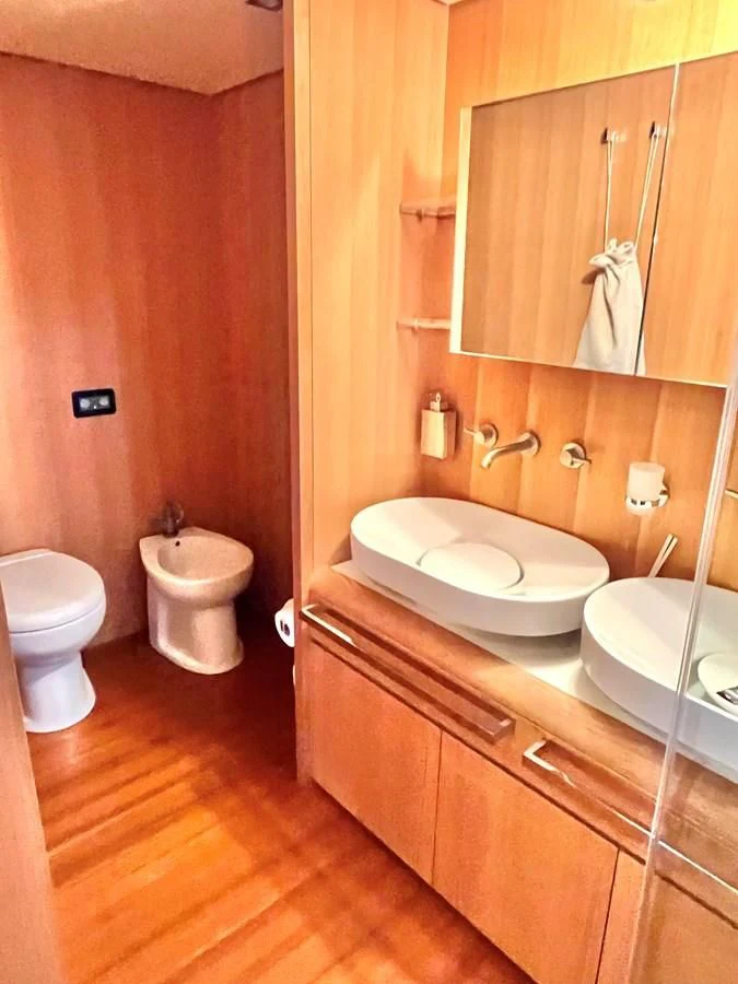 a bathroom with a wood floor aboard AICON 85 Yacht for Sale
