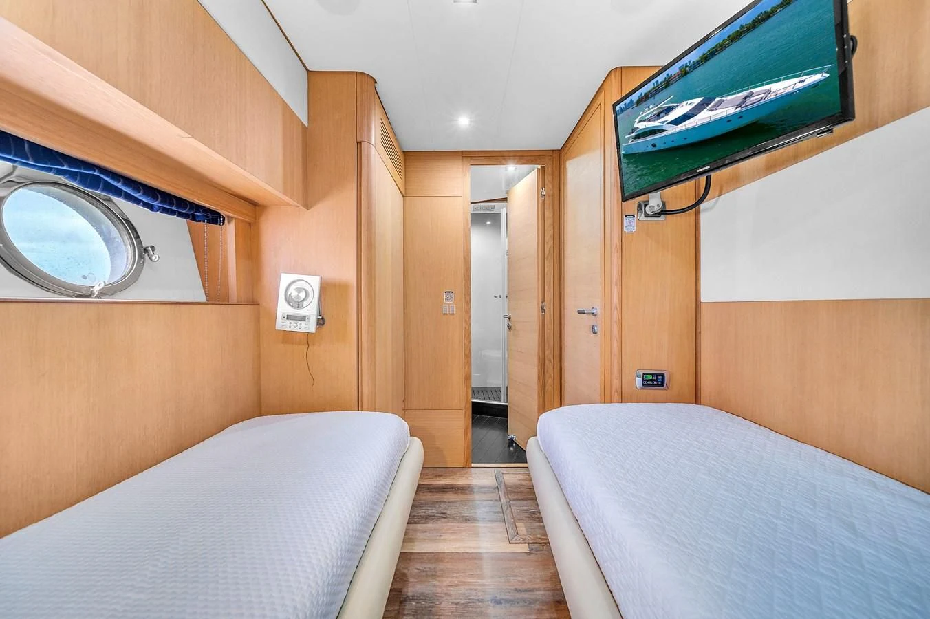 a bed and a television in a room aboard AICON 85 Yacht for Sale