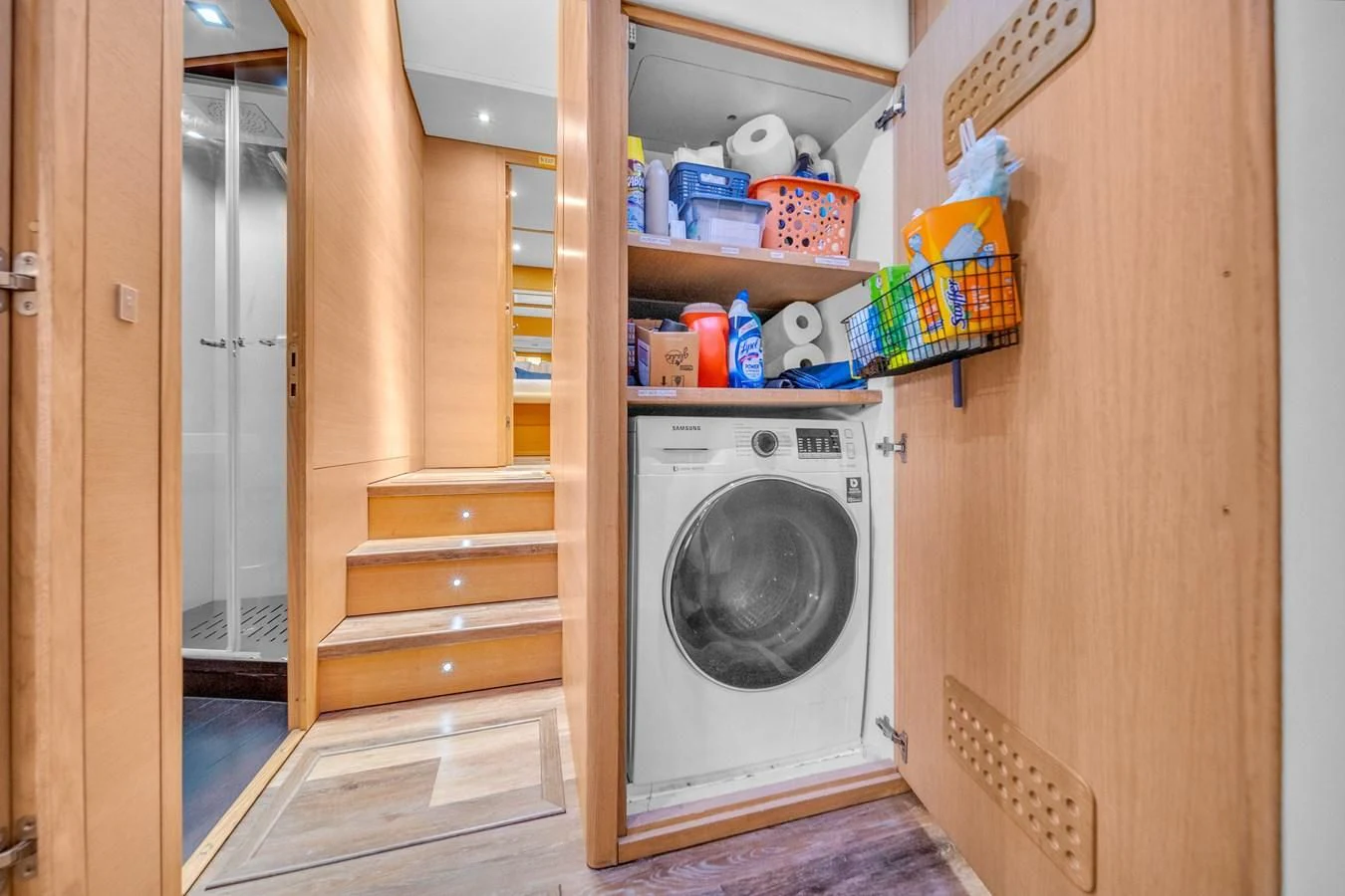 a small laundry room with a dryer and a closet aboard AICON 85 Yacht for Sale