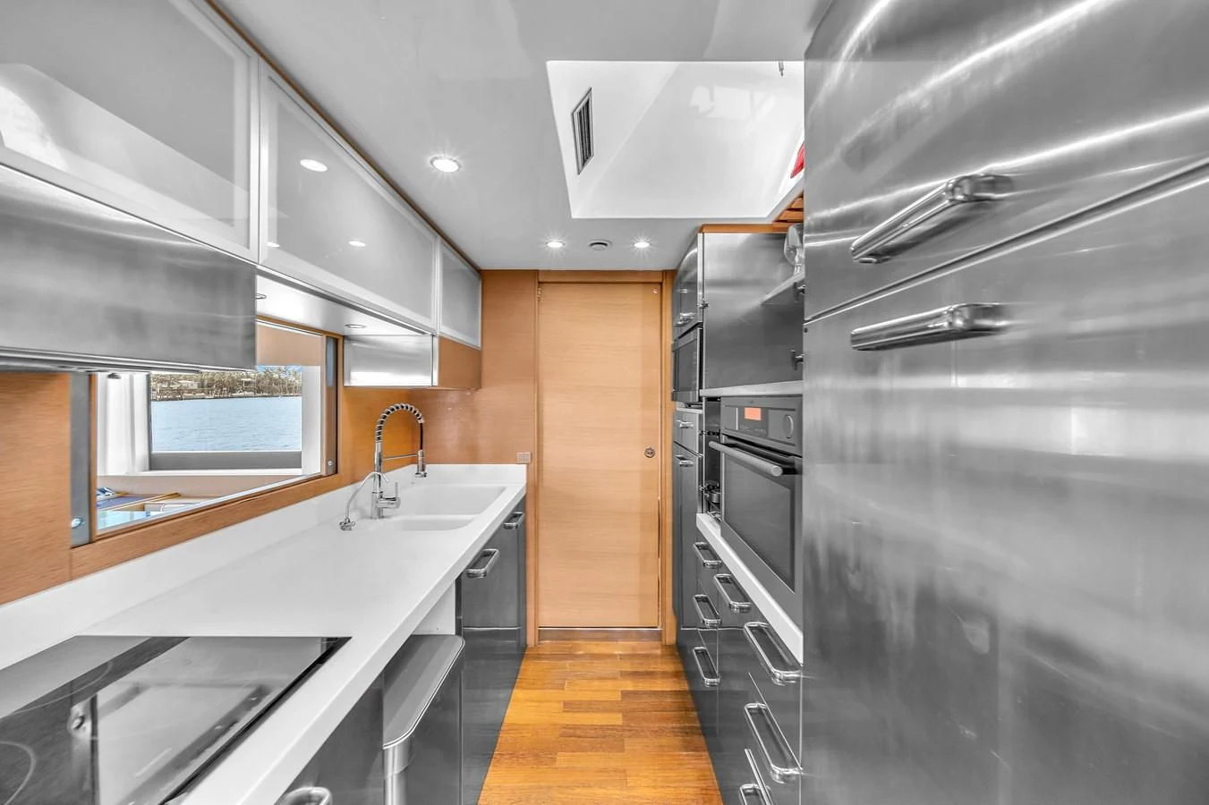 a kitchen with a large island aboard AICON 85 Yacht for Sale