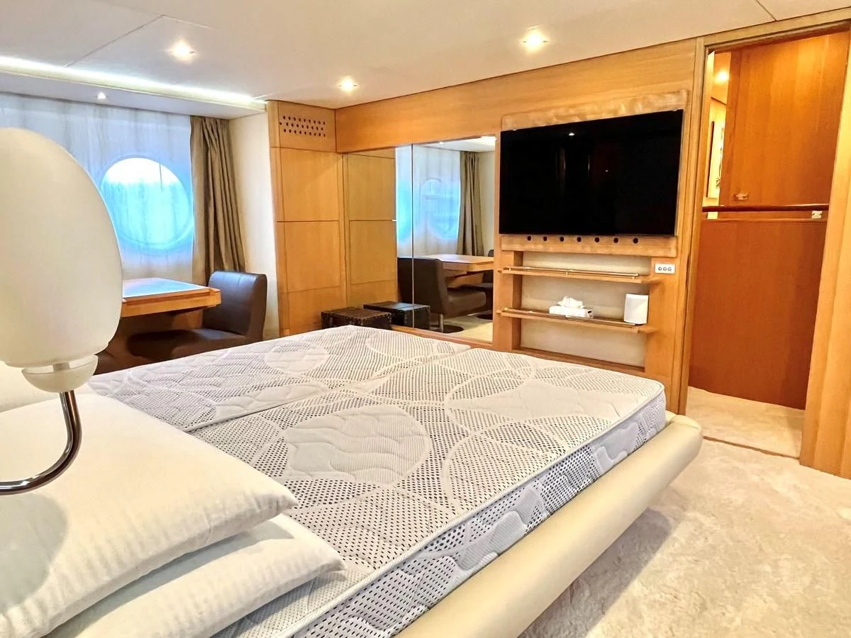a bedroom with a large bed aboard AICON 85 Yacht for Sale