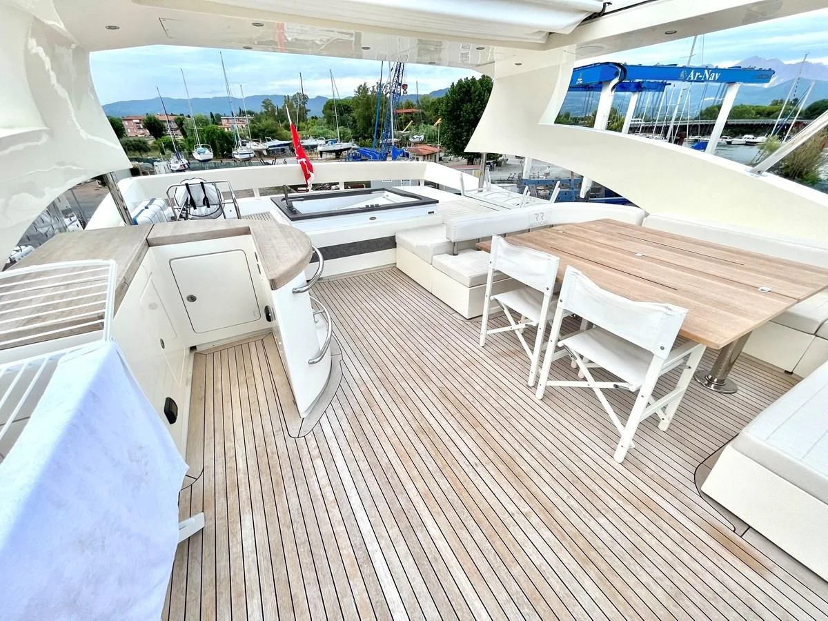 a room with tables and chairs aboard AICON 85 Yacht for Sale