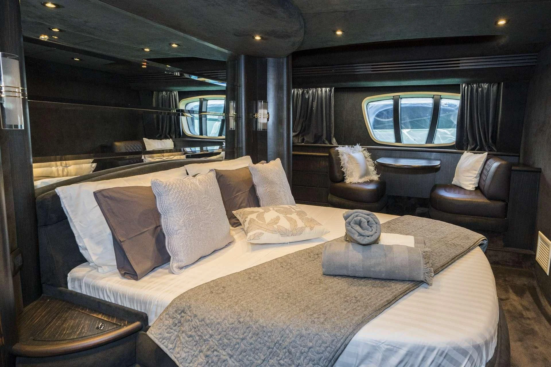 a large bed in a room aboard MEDUSA Yacht for Charter