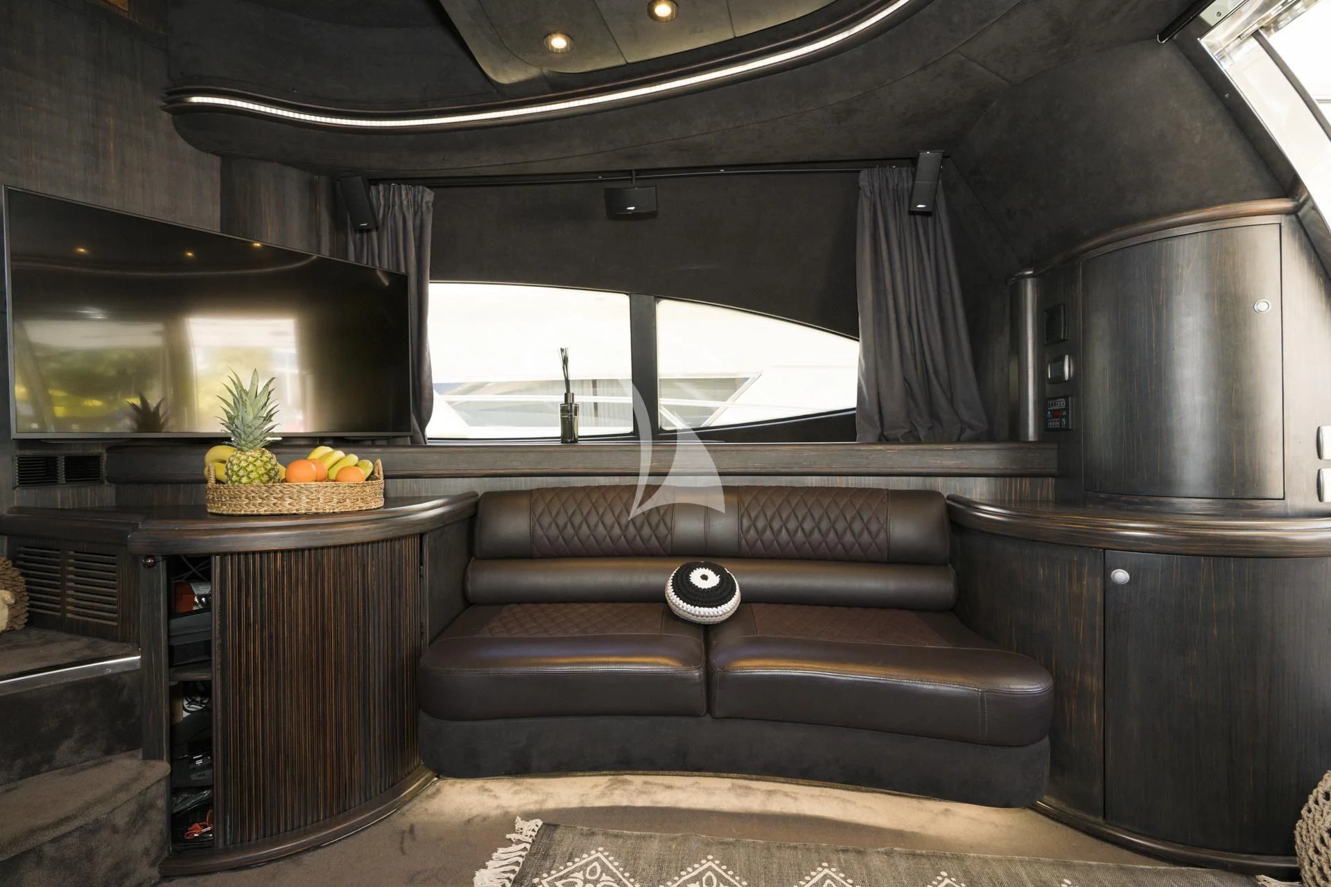a kitchen with a couch and a coffee table aboard MEDUSA Yacht for Charter