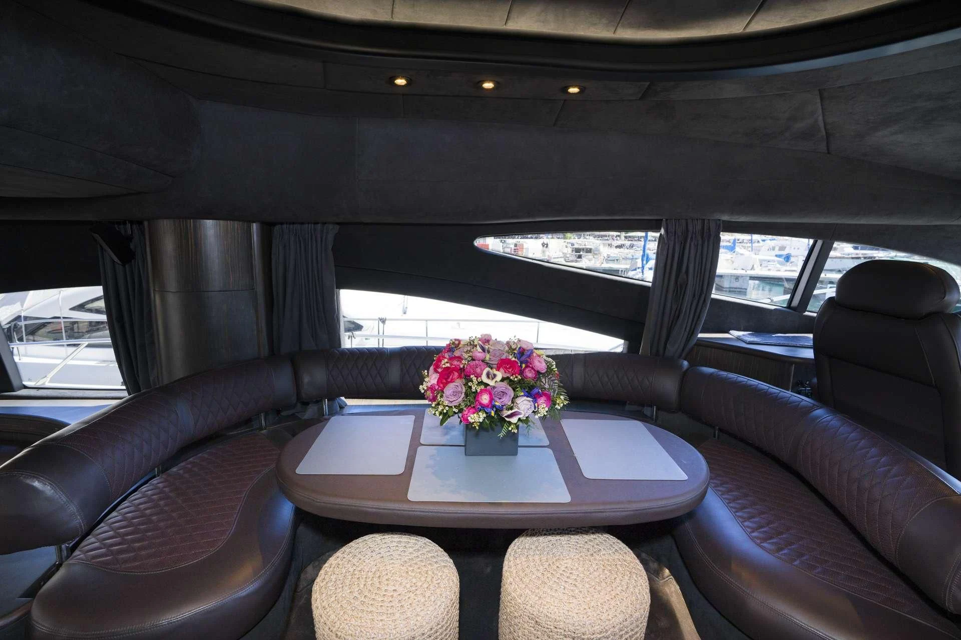 a car with a table and chairs aboard MEDUSA Yacht for Charter