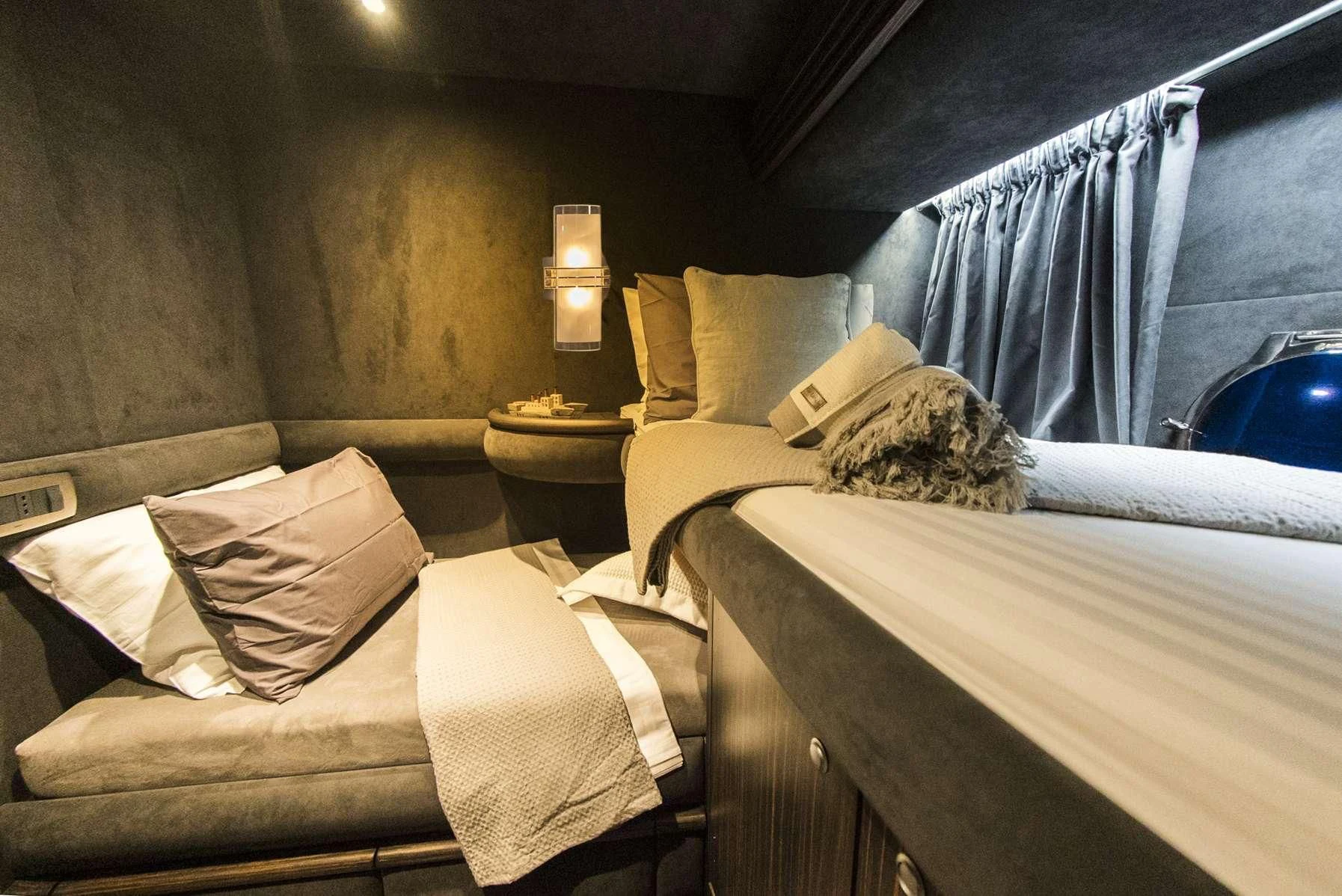 a couple of beds in a room aboard MEDUSA Yacht for Charter