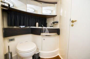 a bathroom with a toilet and a sink aboard MEDUSA Yacht for Charter