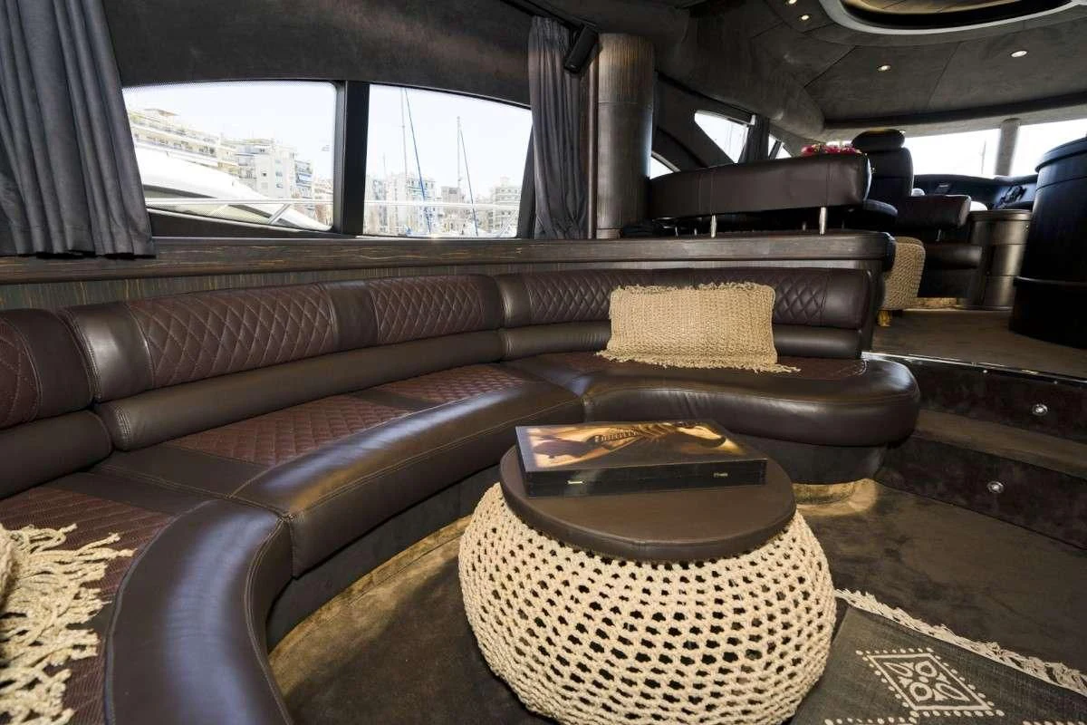 a leather couch in a room aboard MEDUSA Yacht for Charter