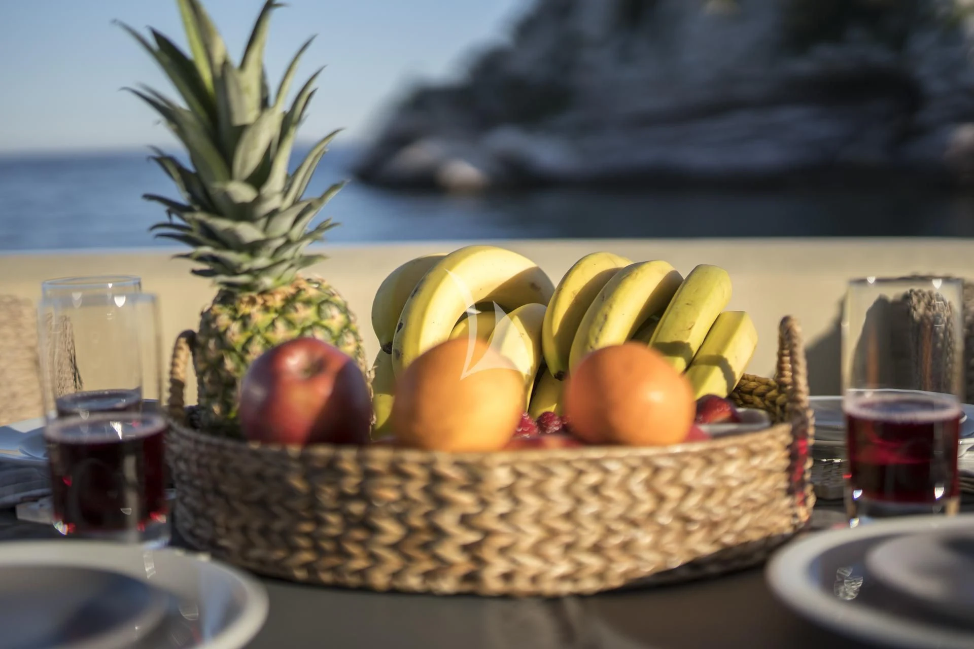 a basket of fruits and drinks aboard MEDUSA Yacht for Charter
