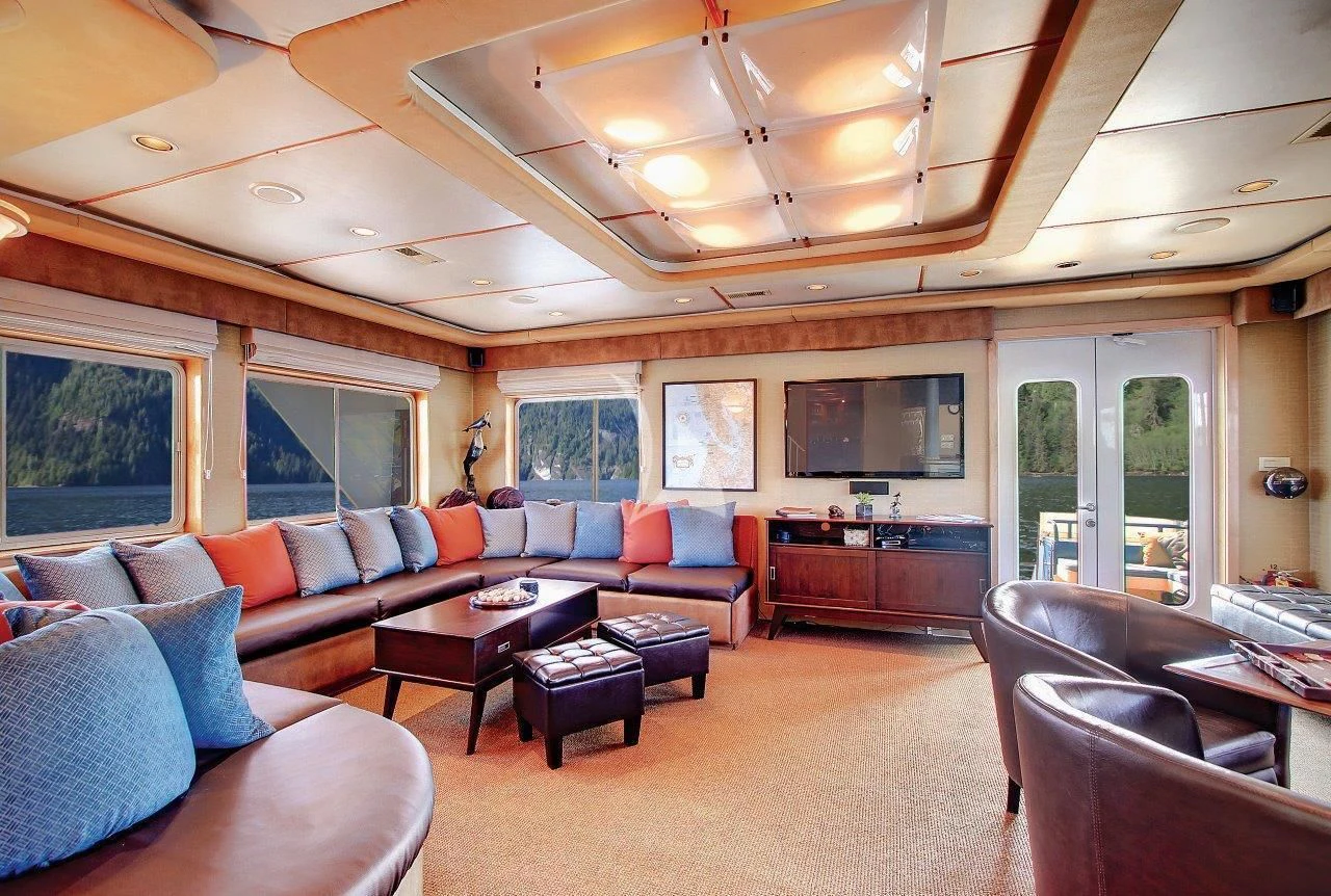 a living room with a large ceiling aboard SAFARI QUEST Yacht for Sale