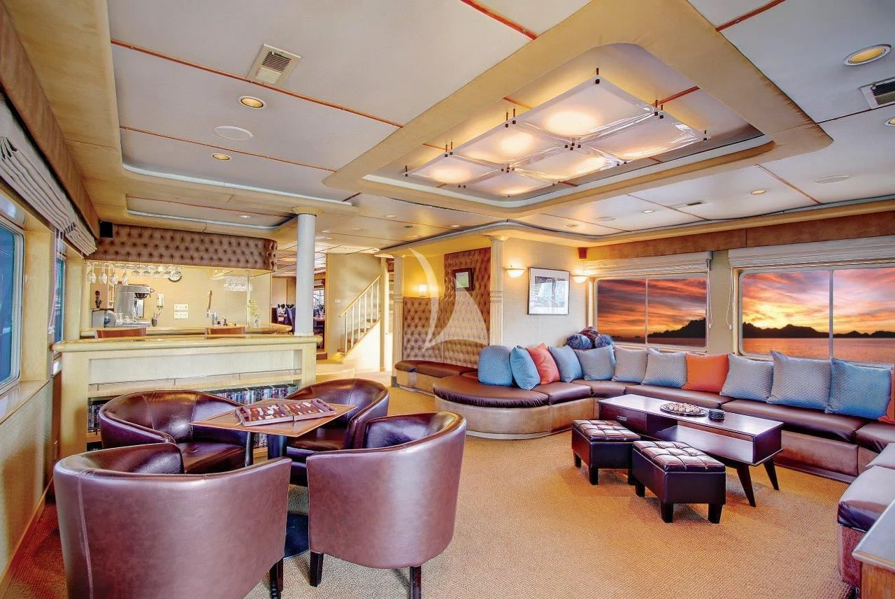 a living room with a large open window aboard SAFARI QUEST Yacht for Sale