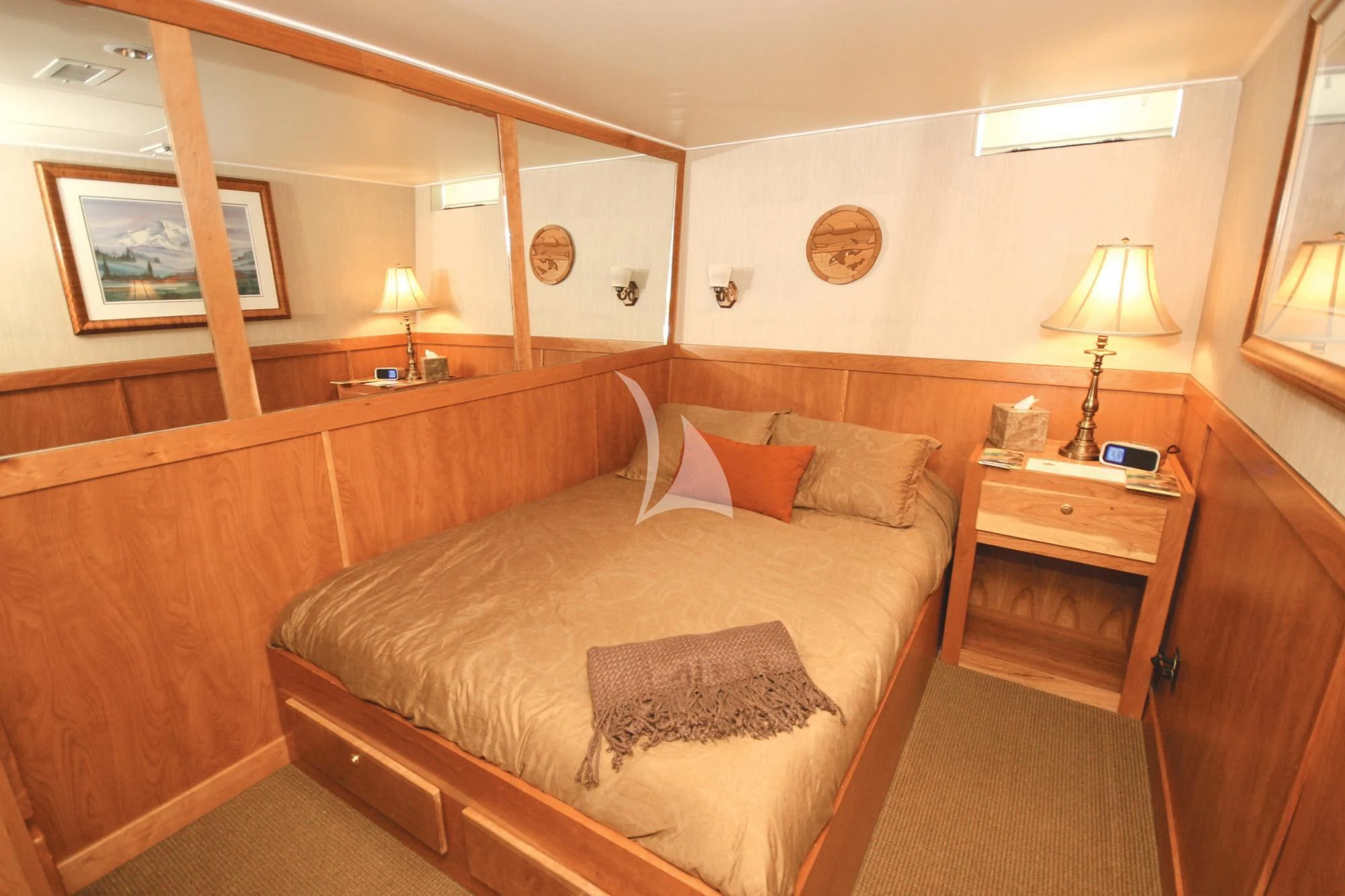 a hotel room with a bed and a desk aboard SAFARI QUEST Yacht for Sale