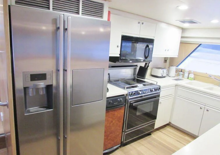a kitchen with stainless steel appliances aboard GOOD NEWS Yacht for Sale
