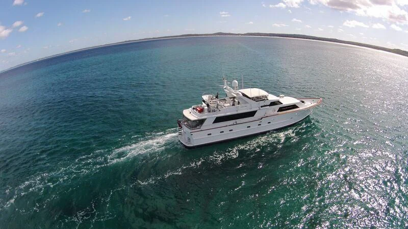 a white boat in the water aboard GOOD NEWS Yacht for Sale