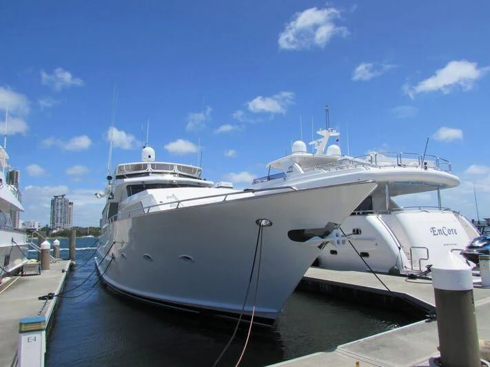 a large white yacht docked aboard GOOD NEWS Yacht for Sale