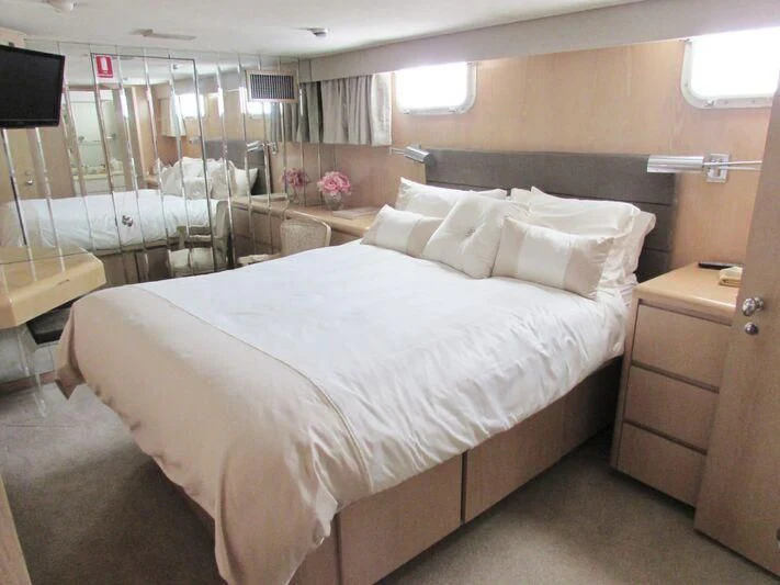 a bed in a room aboard GOOD NEWS Yacht for Sale