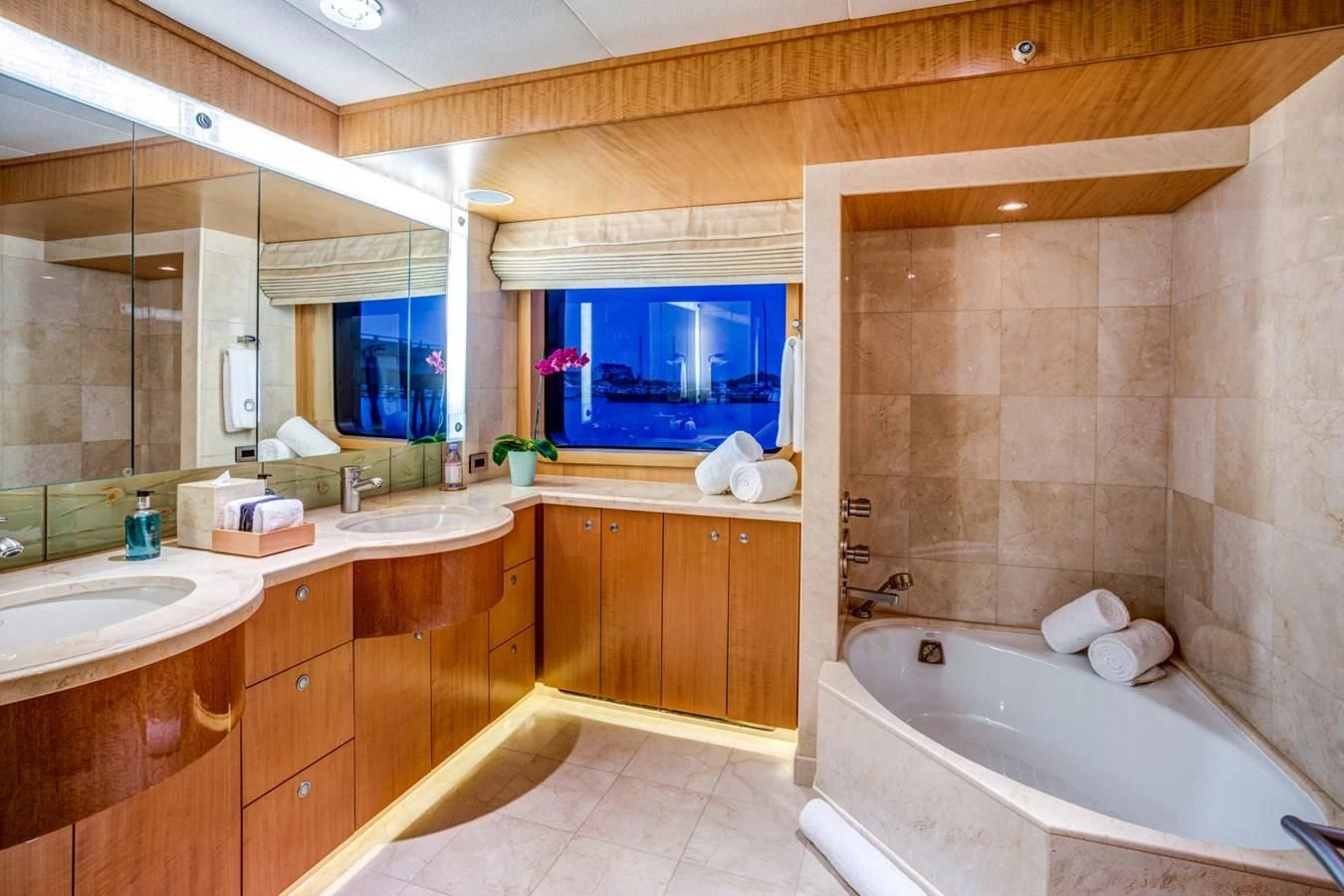 a bathroom with a tub sink and a sink aboard HELIOS 2 Yacht for Sale