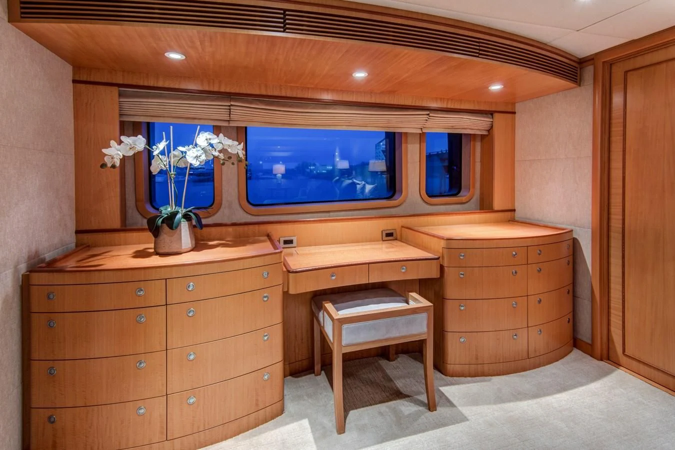a room with a tv and dresser aboard HELIOS 2 Yacht for Sale