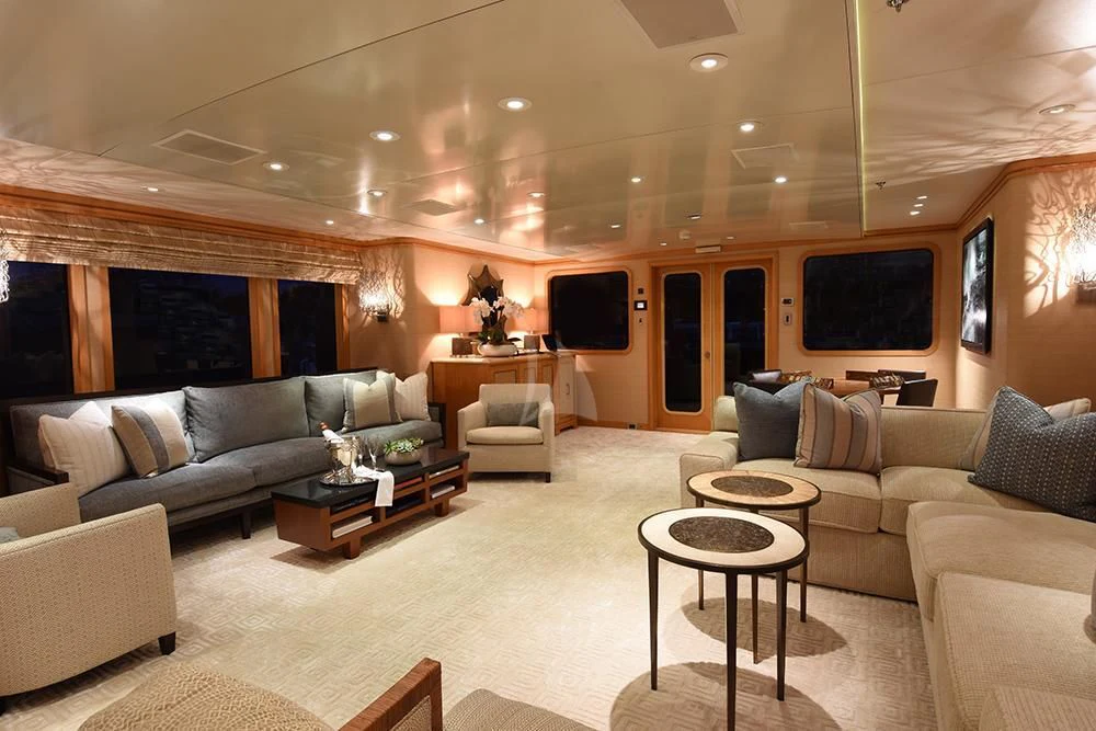 a living room with a large screen aboard HELIOS 2 Yacht for Sale