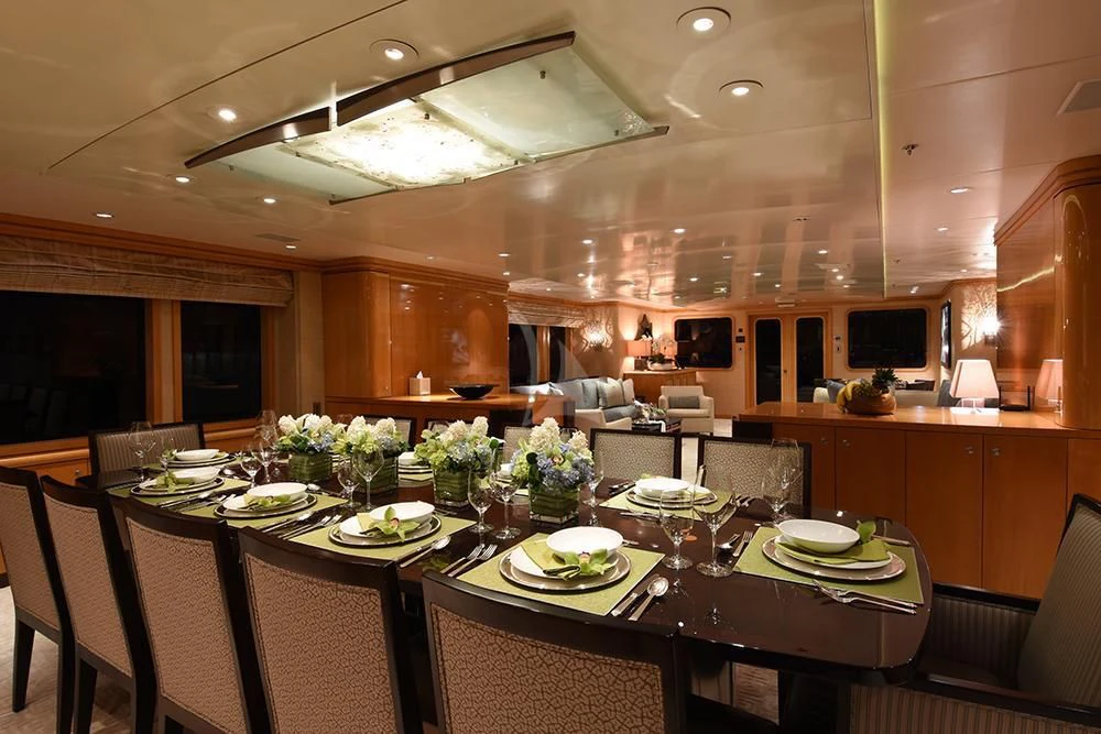 a large dining room with a table set for a meal aboard HELIOS 2 Yacht for Sale