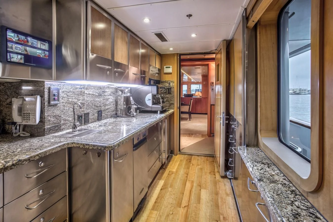 a kitchen with marble counters aboard HELIOS 2 Yacht for Sale