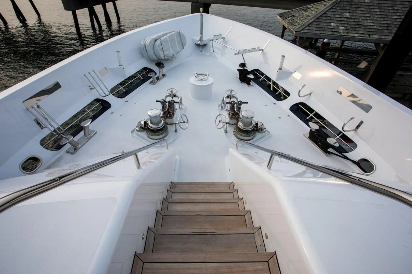 a white building with a staircase and a balcony aboard HELIOS 2 Yacht for Sale