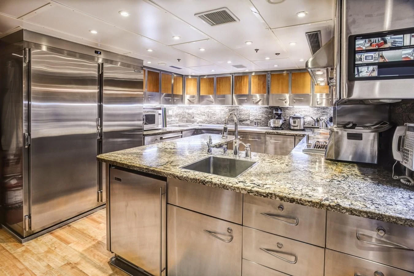 a kitchen with stainless steel appliances aboard HELIOS 2 Yacht for Sale