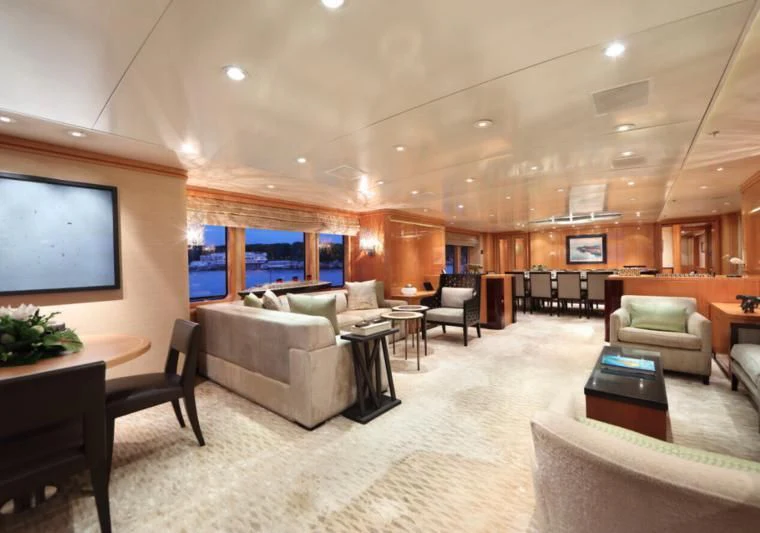 a living room with a large screen aboard HELIOS 2 Yacht for Sale