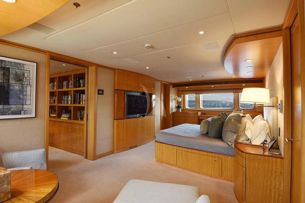 a bedroom with a bed and a tv aboard HELIOS 2 Yacht for Sale