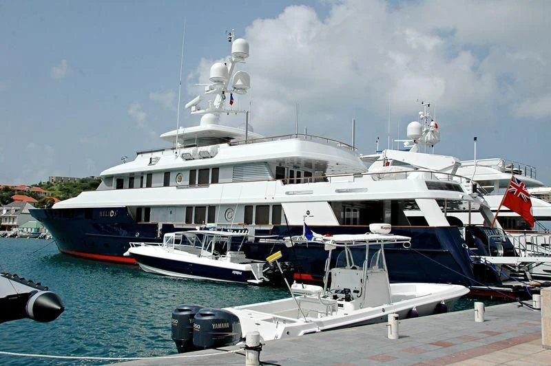 a couple of boats docked at a pier aboard HELIOS 2 Yacht for Sale