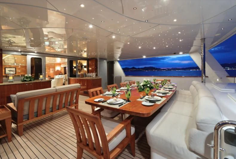 a restaurant with tables and chairs aboard HELIOS 2 Yacht for Sale