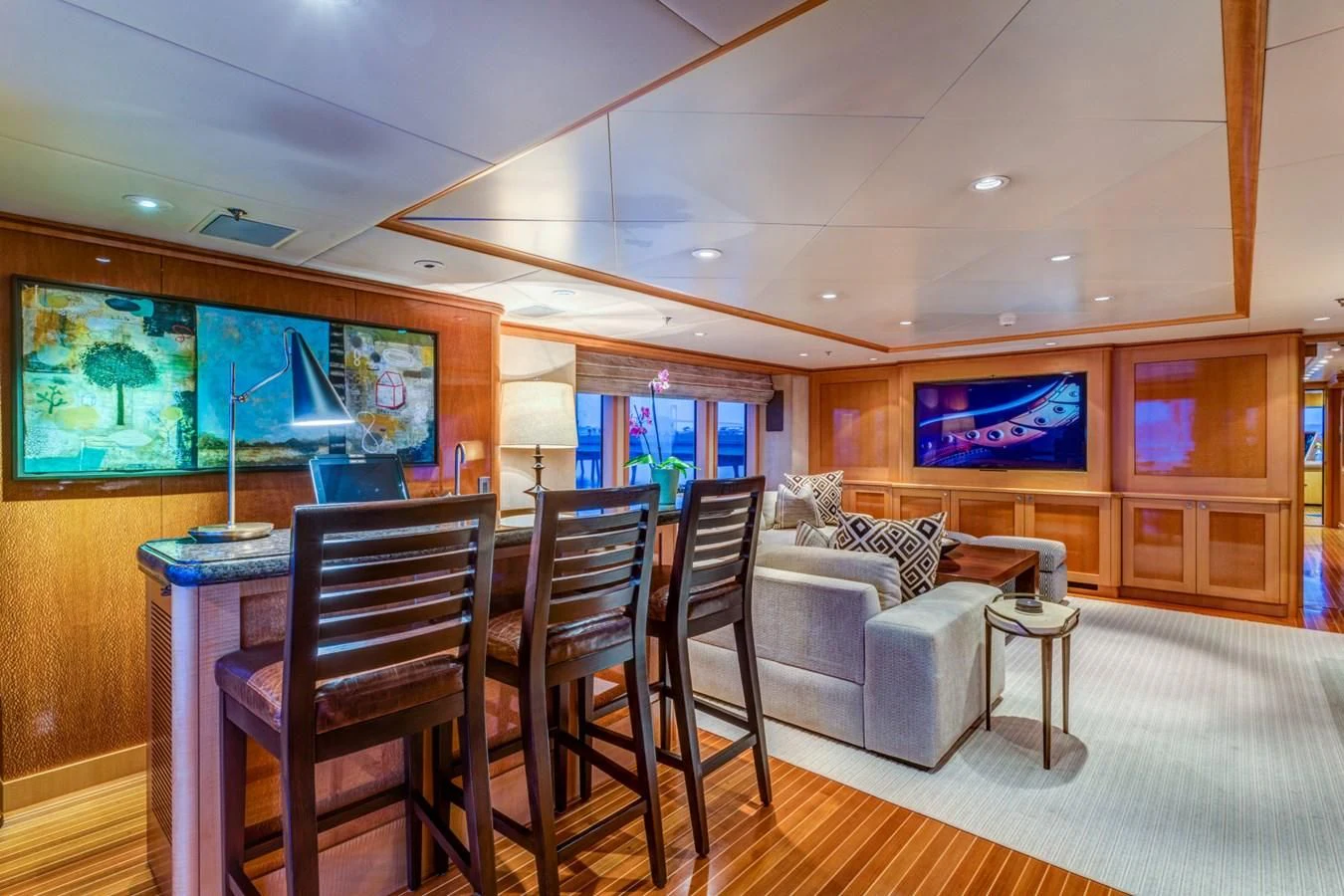 a living room with a table and chairs aboard HELIOS 2 Yacht for Sale