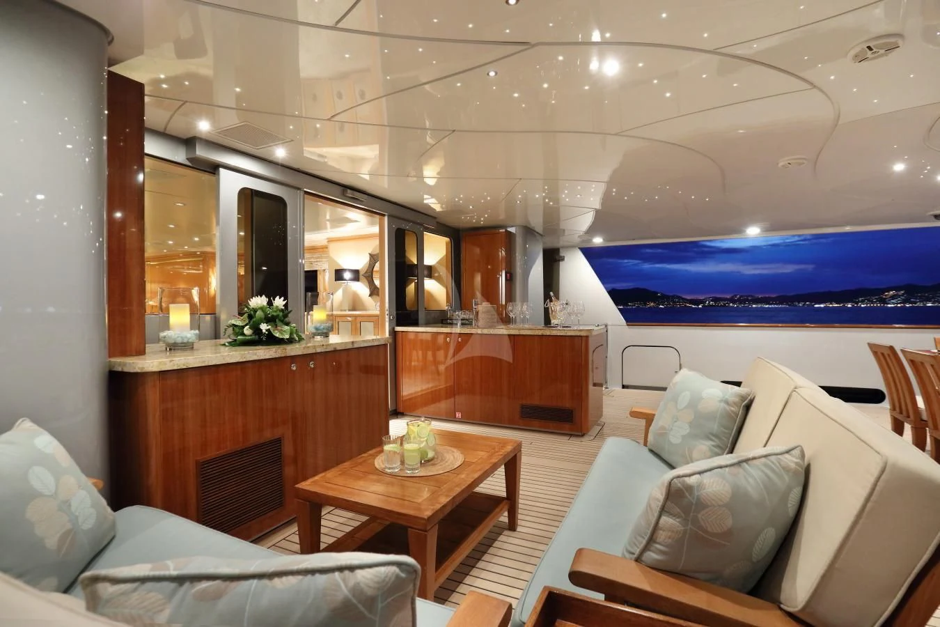 a living room with a large blue screen aboard HELIOS 2 Yacht for Sale